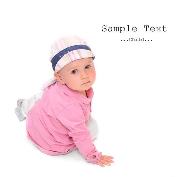 Little child sitting on a white background. — Stock Photo, Image