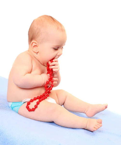 Cute baby with glass necklace. — Stock Photo, Image