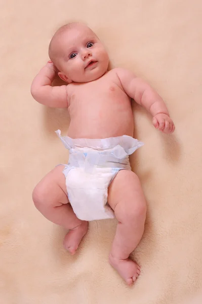 Portrait of a newborn baby in diaper. — Stock Photo, Image