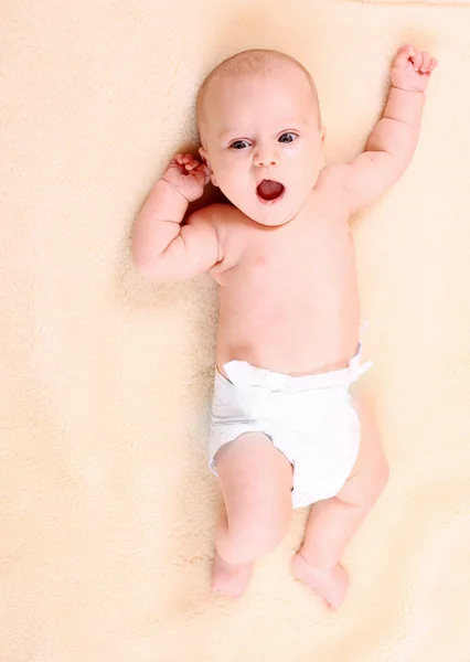 Portrait of a newborn baby in diaper. — Stock Photo, Image