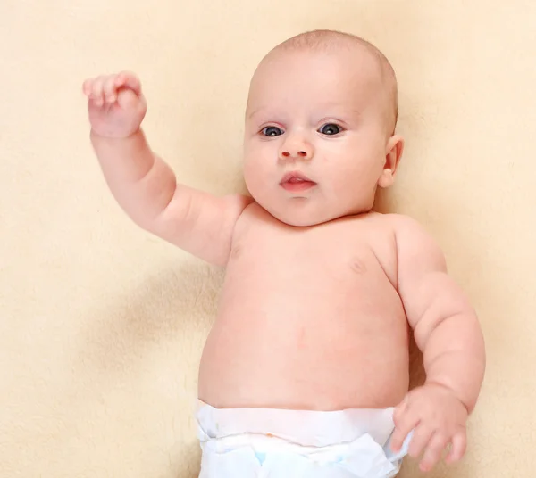 Portrait of a newborn baby in diaper. — Stock Photo, Image