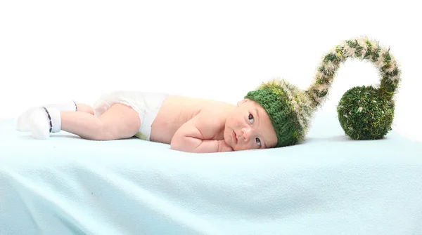 Cute baby with funny knitted hat for cold weather. — Stock Photo, Image