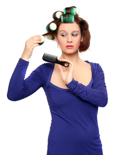 Menina agradável com encrespadores de cabelo coloridos — Fotografia de Stock