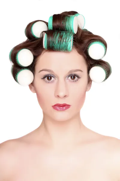 Girl is having hair curlers on her head — Stock Photo, Image