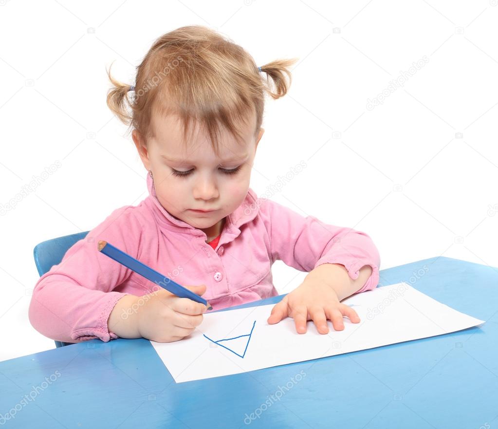 Little scholar in the school desk.