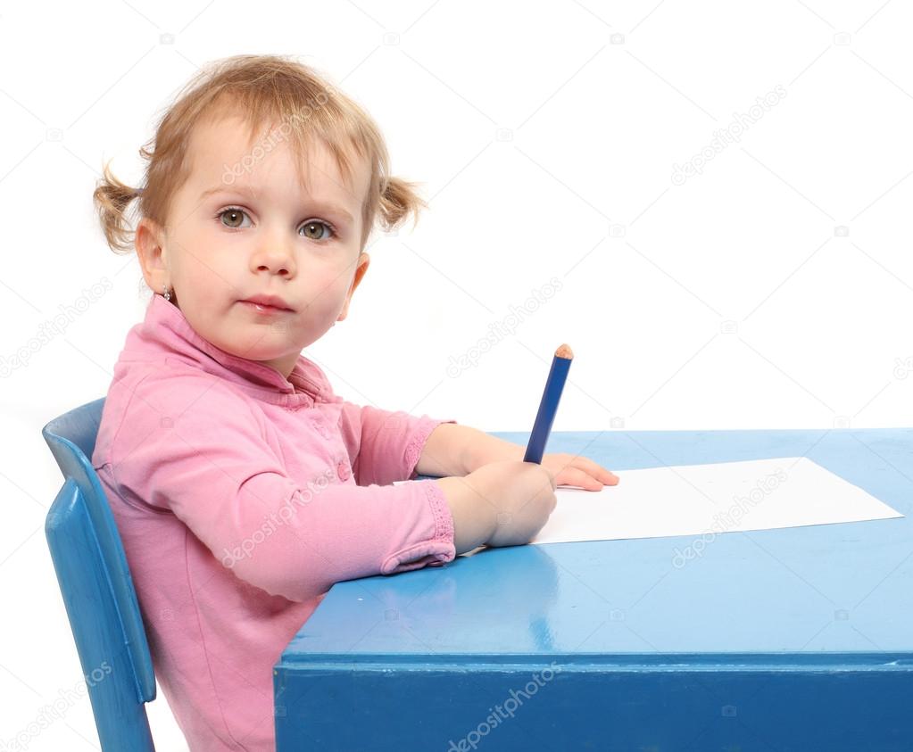 Little scholar in the school desk.