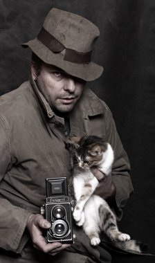 fotoğrafçı ile kamera ve kedi