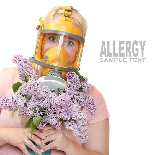 Woman with flowers in protection mask — Stock Photo, Image