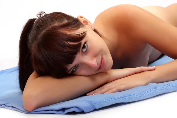 Picture of attractive suntanned girl dressed in blue towel — Stock Photo, Image