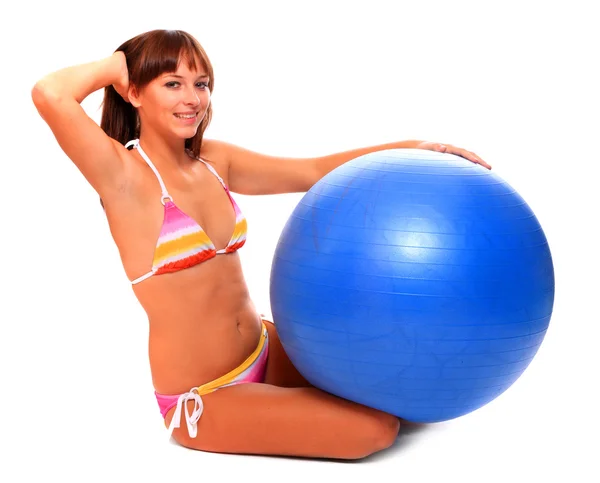 Sporty young woman with blue ball. — Stock Photo, Image