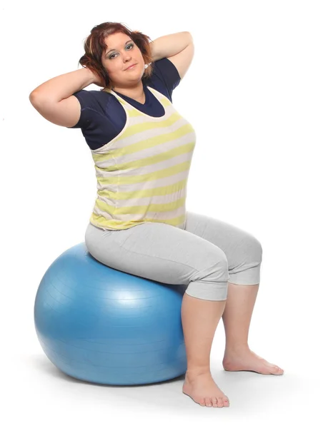 Overweight woman with blue ball — Stock Photo, Image