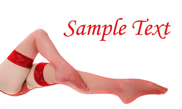 Slim legs in red net nylons — Stock Photo, Image