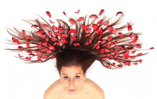 Woman with flowers on hair — Stock Photo, Image