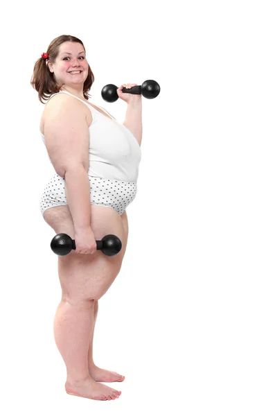 Mujer feliz con sobrepeso haciendo ejercicio sobre fondo blanco . — Foto de Stock