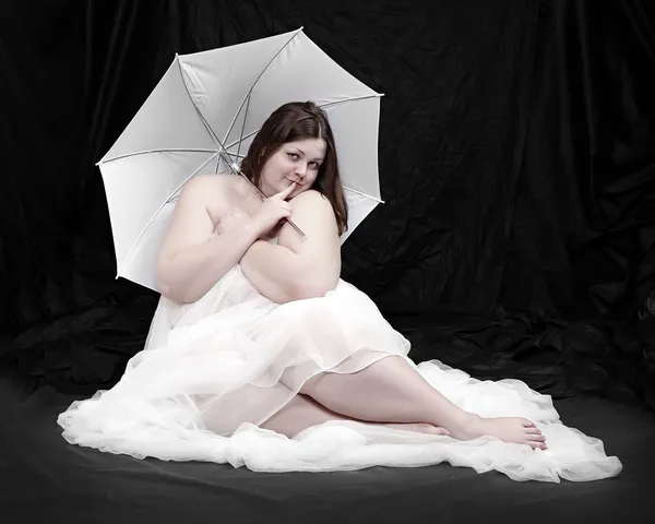 Retro style picture of a overweight woman posing on a black background. — Stock Photo, Image