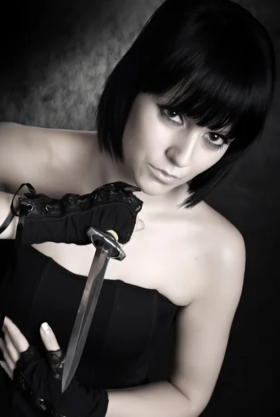 Girl with sharp dagger — Stock Photo, Image