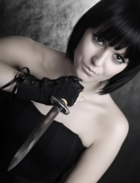 Girl with sharp dagger — Stock Photo, Image