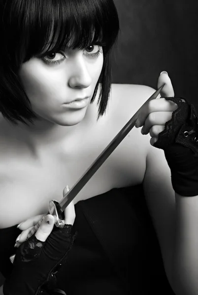 Girl with a dagger — Stock Photo, Image