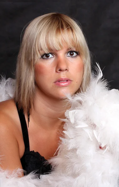 Portrait of beautiful blonde woman with boa. Studio shot — Stock Photo, Image