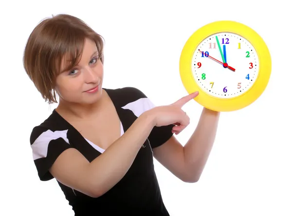 Beautiful blonde holding funny clock. Conceptual image. — Stock Photo, Image