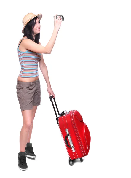 Woman going on vacation with camera and her suitcase. — Stock Photo, Image