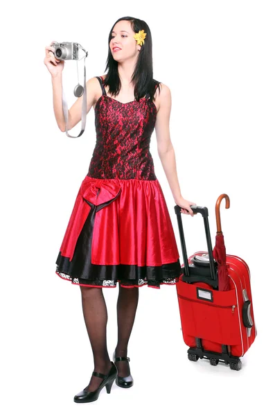 Ung kvinna går på semester med sin resväska. — Stockfoto