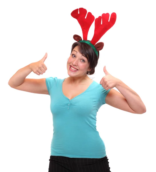 Gelukkig jonge vrouw in rendieren kostuum genieten van Kerstmis partij. — Stockfoto