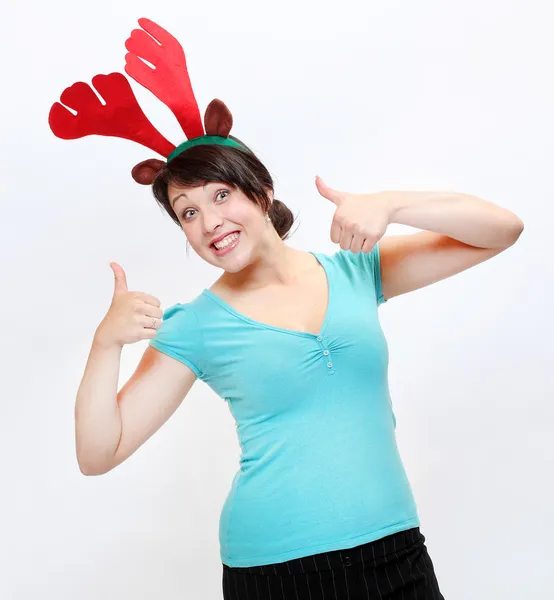 Jovem feliz em traje de rena desfrutando de festa de Natal . — Fotografia de Stock