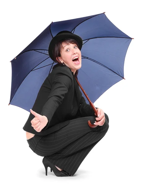 Crazy businesswoman in bowler hat with umbrella. — Stock Photo, Image