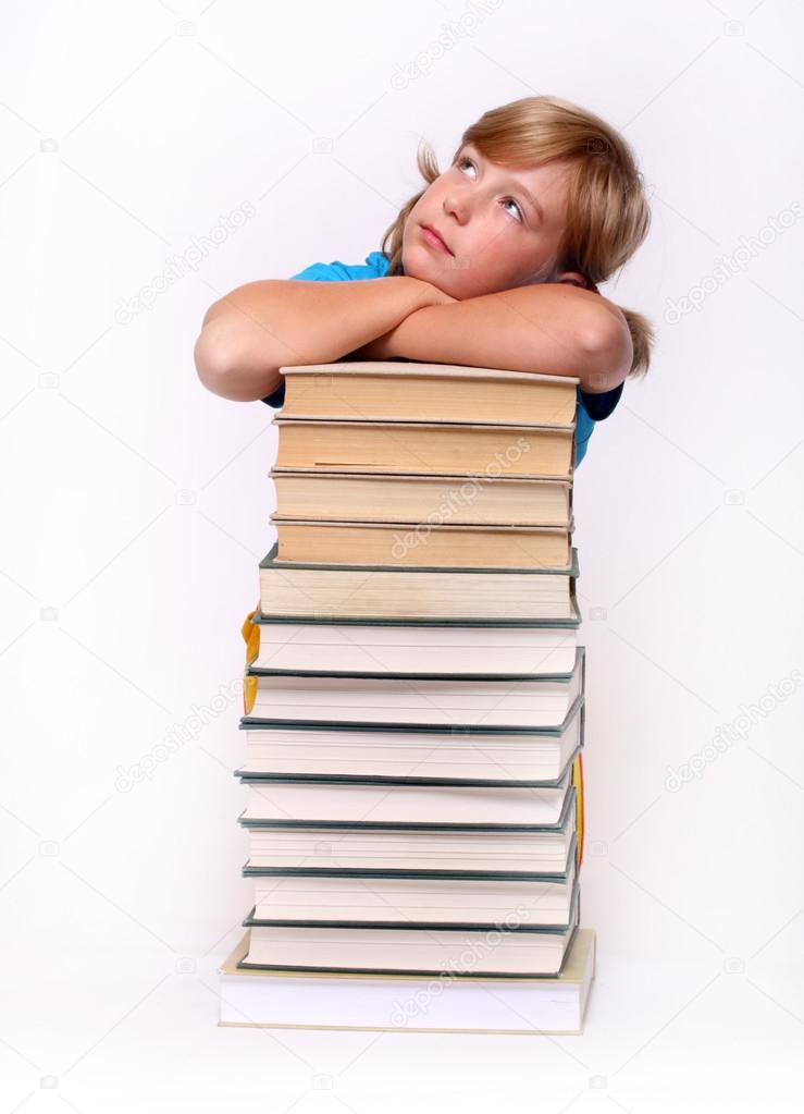 Pretty girl on stack of book dreaming