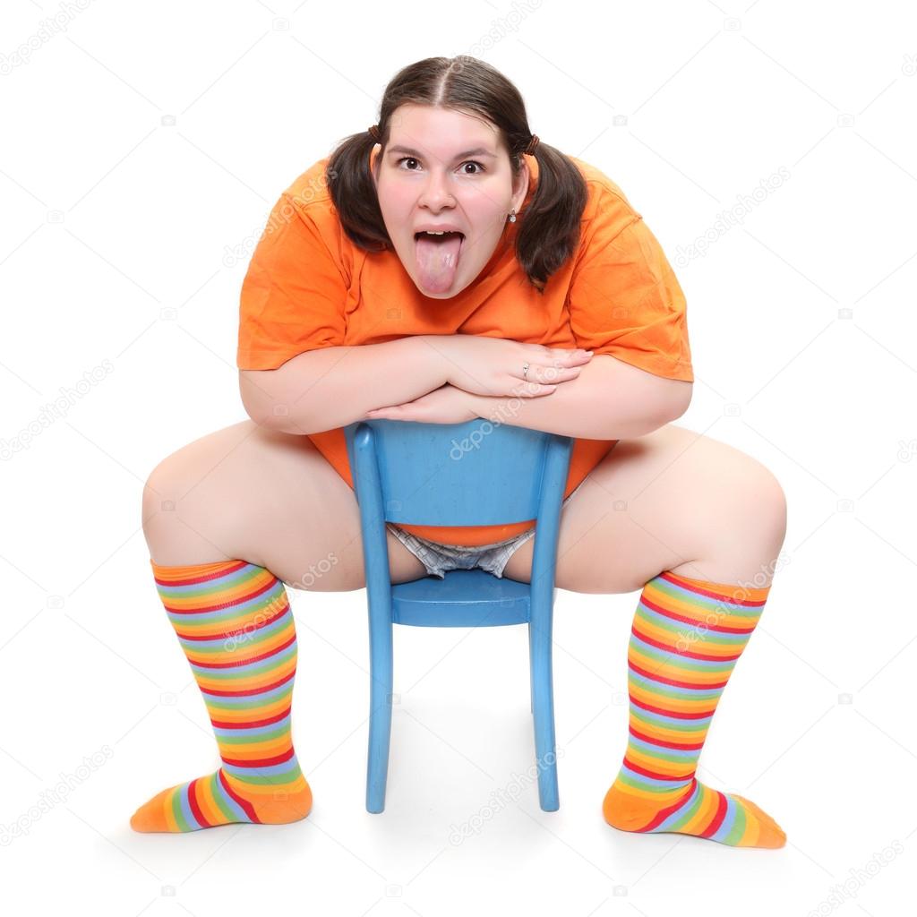 Crazy teenager on a blue chair. Behavioral disturbance in the pubescence.