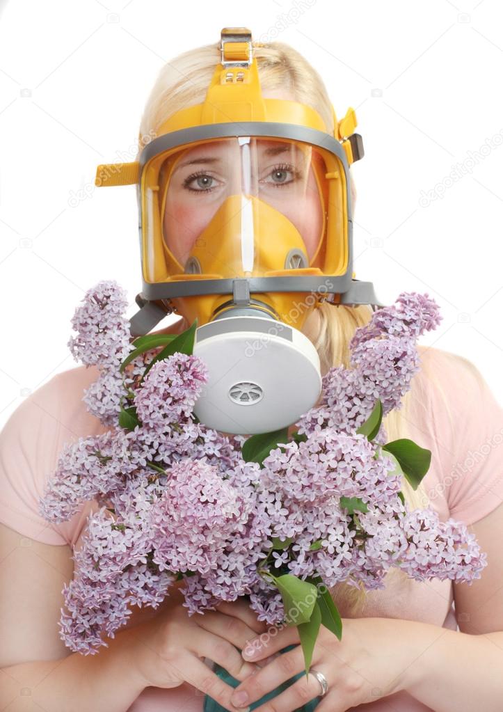 Woman with flowers in protection mask