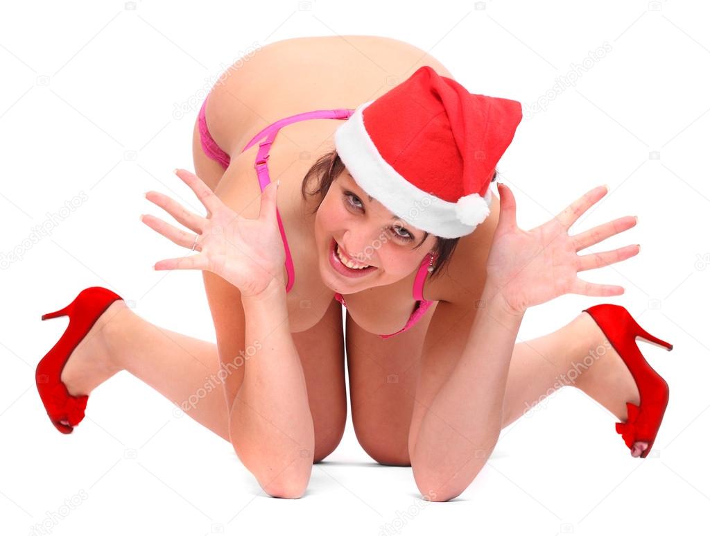 Happy young woman dressed in Santa claus costume.