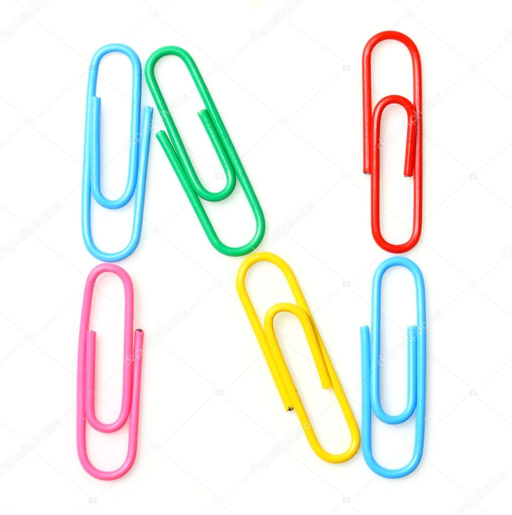 Colorful letter N from paperclips.