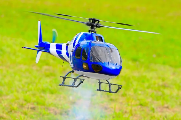 Flying helicopter (radio controlled scale-model 1:24 scale) — Stock Photo, Image