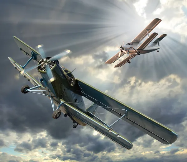 Biplanes in cloudy sky — Stock Image Biplanes in cloudy sky Royalty Free Stock Images
