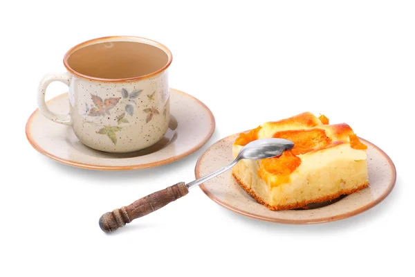 Apricot cake on a dessert plate and cup of tea. — Stock Photo, Image