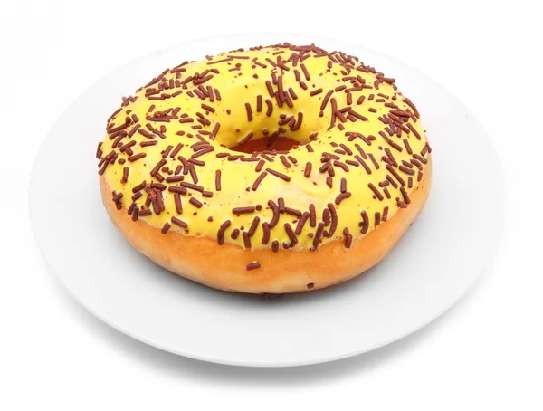 Vanilla glazed donut with cocoa sprinkles — Stock Photo, Image