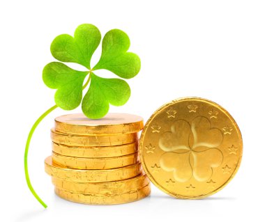 Golden euro coins with four leaf clover clipart