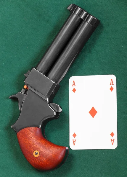 Gun and ace card — Stock Photo, Image