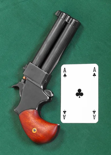 Gun and ace card — Stock Photo, Image