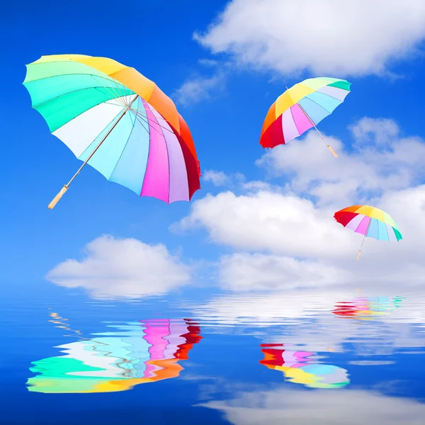 Três guarda-chuvas arco-íris — Fotografia de Stock