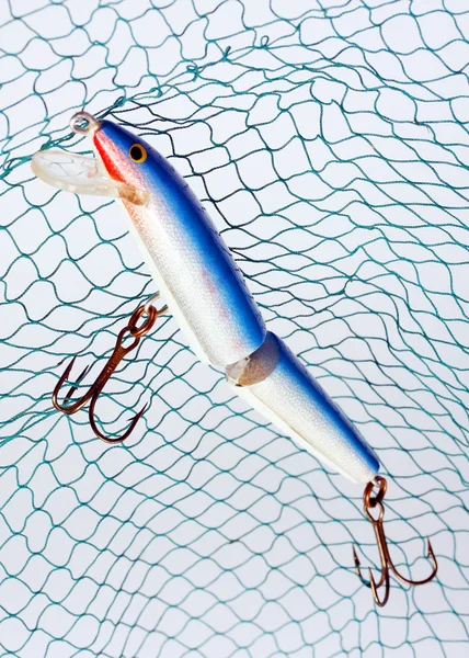 Fishing lure against water level Stock Photo by ©vladvitek 33798361