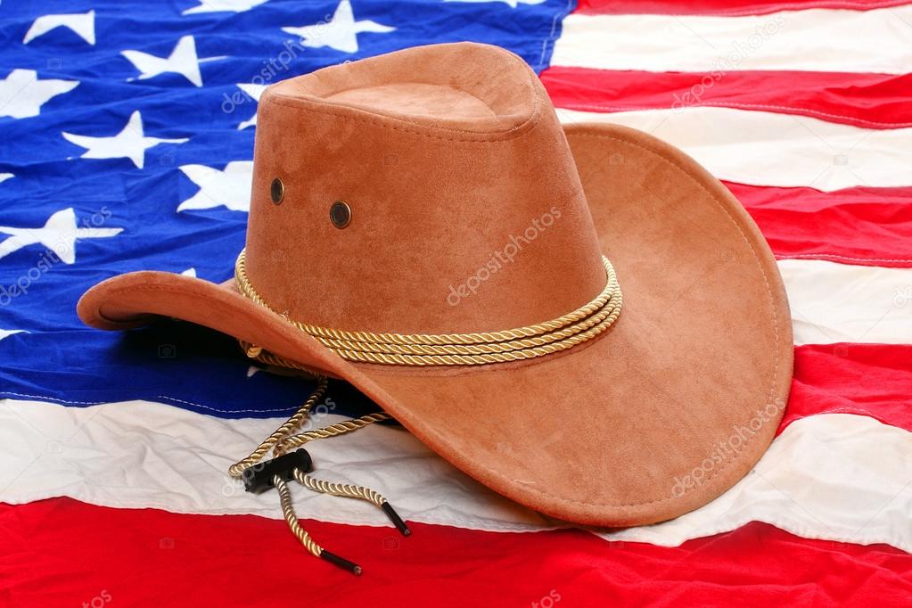 Brown leather hat on american flag