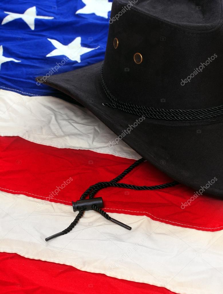 Black leather hat on american flag