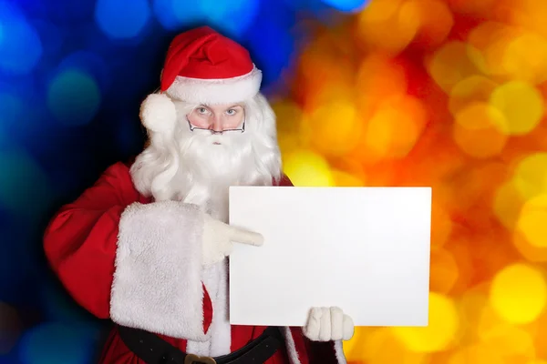 Santa showing paper — Stock Photo, Image