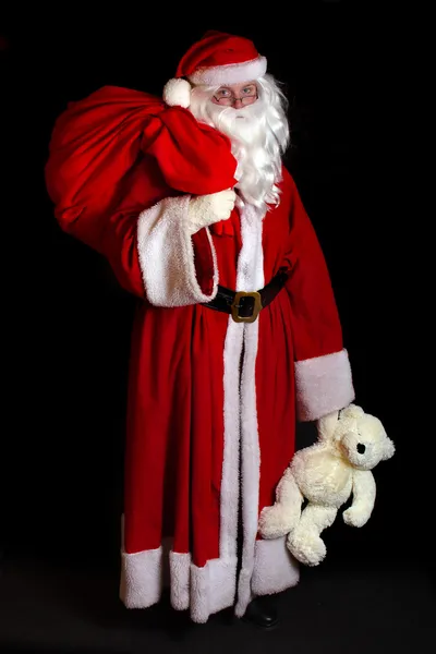 Babbo Natale con un giocattolo — Foto Stock