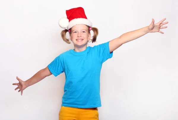 Mädchen mit Weihnachtsmütze — Stockfoto