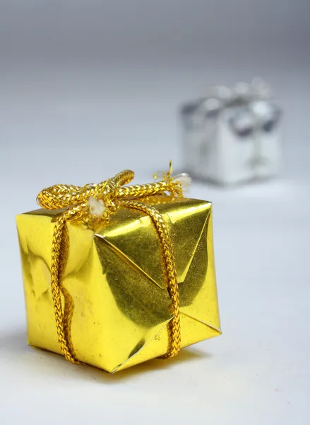 Closed golden and silver box for gift — Stock Photo, Image