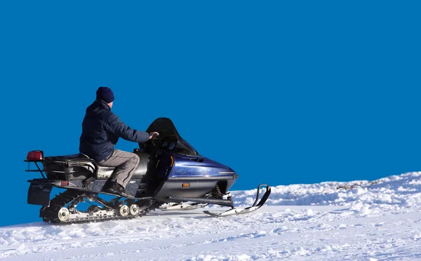 Man op een sneeuwscooter — Stockfoto